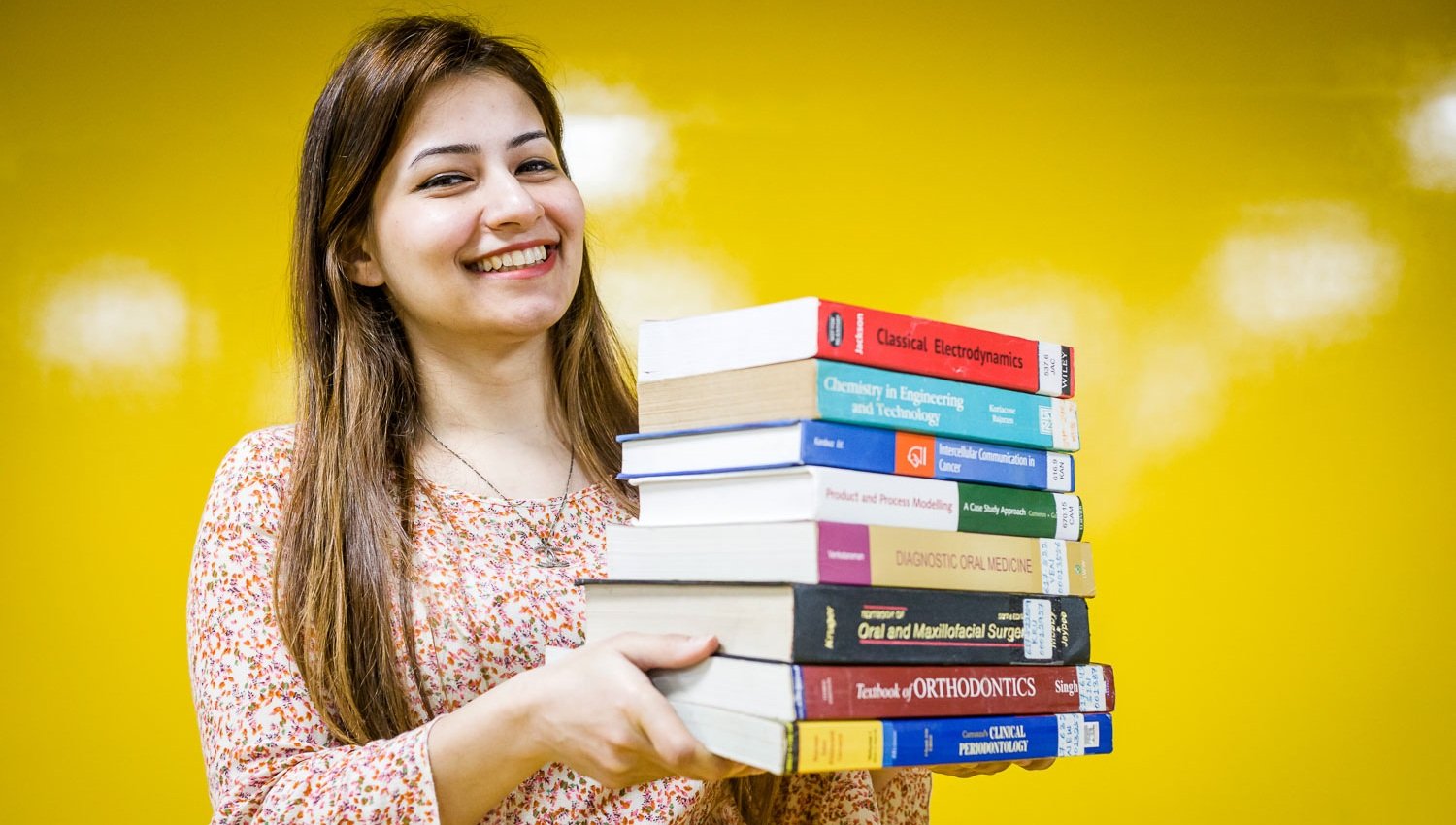 KIIT student holding books